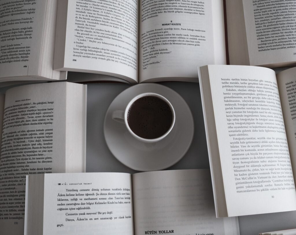 Relaxing setup with open books and a coffee cup, perfect for a serene reading session.